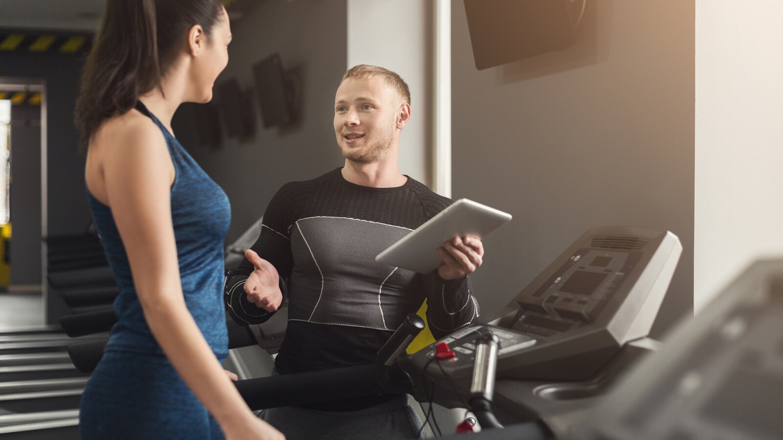 Coach reviewing treadmill test data with an athlete