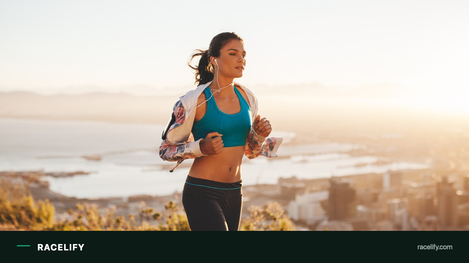 Runner training in strong daylight along the coast