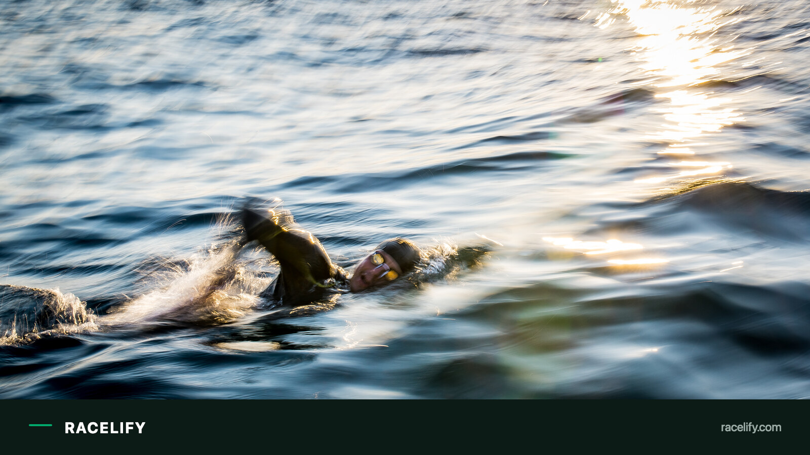 Open water swimmer drafting in the sea