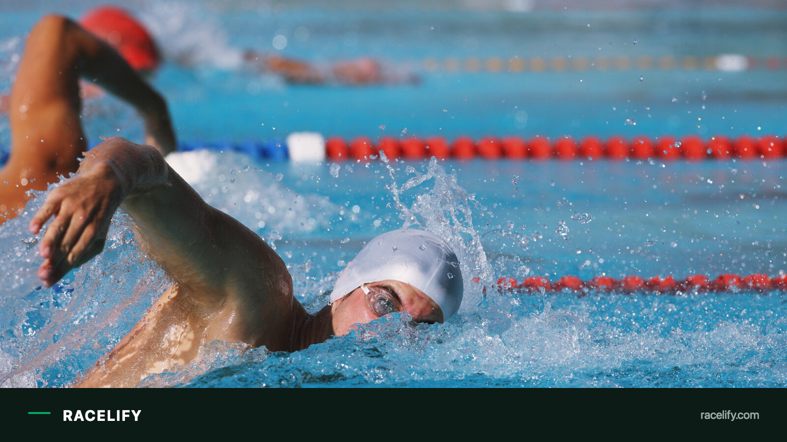 Swimmer holding freestyle in a pool lane
