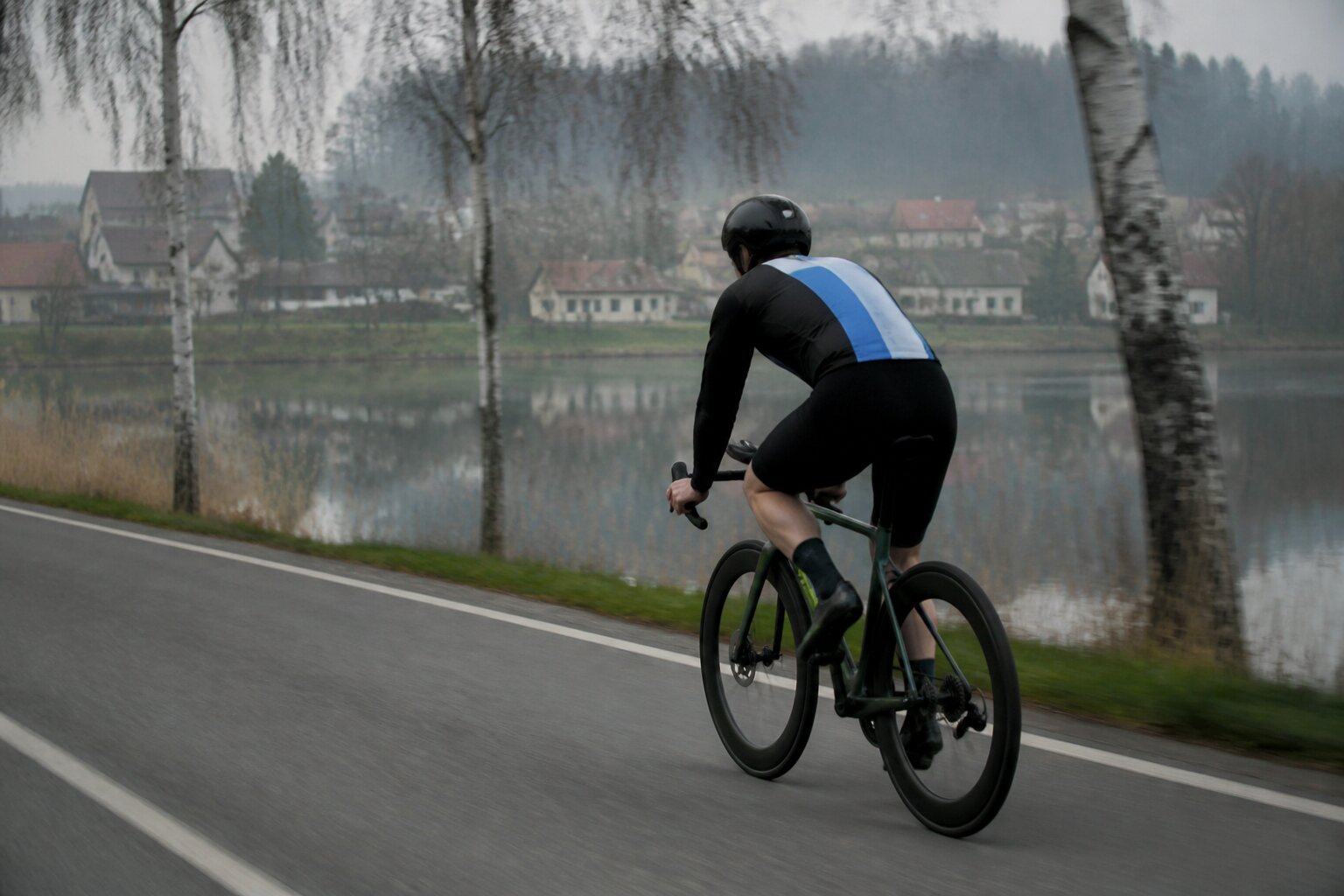 Deep-section carbon aero wheel on a triathlon bike