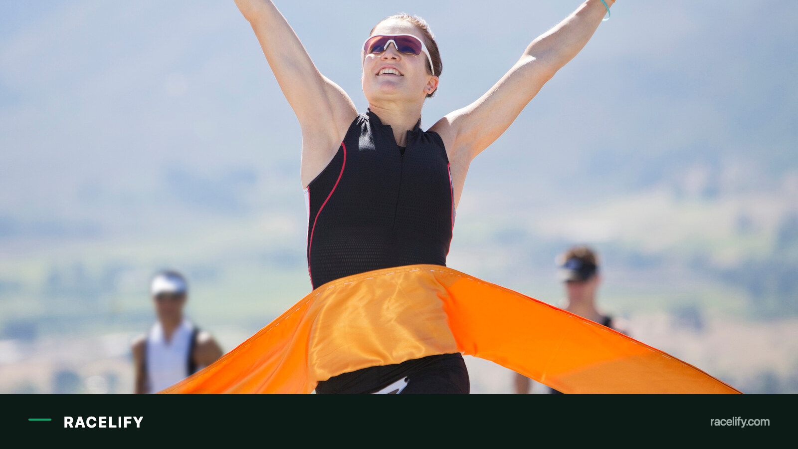 Athlete winning a race at the finish tape