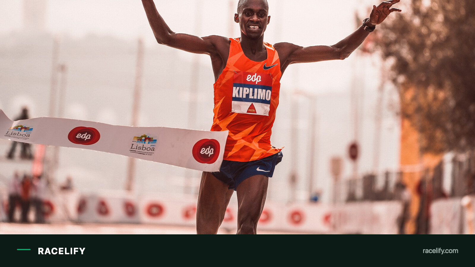 Athlete breaking the tape at the finish